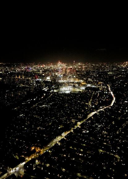 Night view of London from a helicopter.