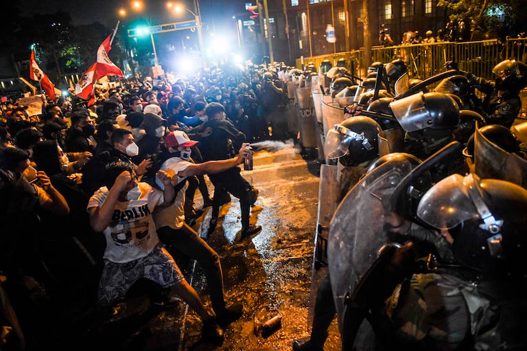 Protesters clash with police in central Lima, Peru