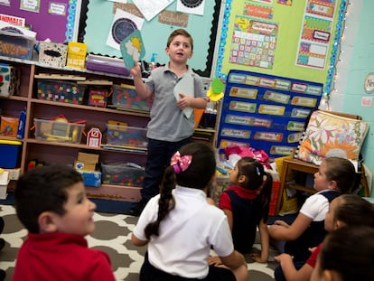 Kindergarten boy talks about the weather in class.