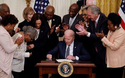 President Joe Biden signs the law to commemorate the end of slavery on June 19 as a federal holiday at the White House.
