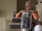 Maixabel Lasa, whose husband was killed by ETA hitmen, poses with a photo of the couple when they were 16 years old.