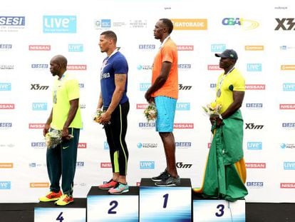 Churandy Martina, Ryan Bailley, Usain Bolt y Jose Carlos Gomes, en el podio.