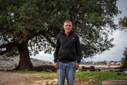 Farmer Hazel Mazguit, next to his house in Arab el Aramshe, one of the closest to the Lebanese border.