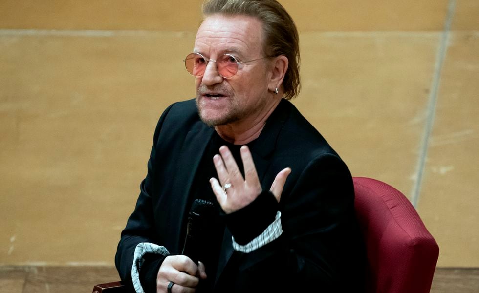 Bono speaks with Cathedral Canon historian Jon Meacham at the Washington National Cathedral on Dec. 5, 2022, in Washington.  The Irish lead singer of U2 will be among the featured guests sitting alongside first lady Jill Biden at President Joe Biden's State of the Union address on Tuesday night, Feb. 7, 2023. (AP Photo/Nathan Howard, File)