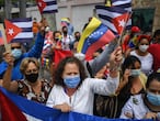 People in Caracas demonstrate in support of the Cuban government and their supporters, outside the Cuban embassy in the Venezuelan capital on July 12, 2021. - Thousands of Cubans took part in rare protests Sunday against the communist government, chanting "Down with the dictatorship" as President Miguel Diaz-Canel called on his supporters to confront the demonstrators. The anti-government rallies started spontaneously in several cities as the country endures its worst economic crisis in 30 years, with chronic shortages of electricity and food. (Photo by Federico PARRA / AFP)