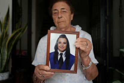 Victoria Cortés, the victim's grandmother, holds a photograph of her granddaughter Juana, murdered by her husband in Pozoblanco, in Córdoba, a victim of sexist violence.