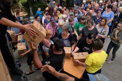 Hundreds of local residents from the Zaporizhzhia region receive humanitarian aid from a non-governmental organisation on September 12, 2023 in Mykhailo-Lukasheve, Ukraine