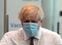 Britain's Prime Minister Boris Johnson (L) walks with clinical lead for UCLH's mass vaccination centre, Debs Scott after receiving his second jab of the Oxford/AstraZeneca Covid-19 vaccine at the Francis Crick Institute in central London on June 3, 2021. (Photo by Matt Dunham / POOL / AFP)