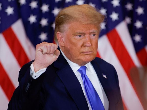 U.S. President Donald Trump raises his fist as he reacts to early results from the 2020 U.S. presidential election in the East Room of the White House in Washington, U.S., November 4, 2020. REUTERS/Carlos Barria     TPX IMAGES OF THE DAY