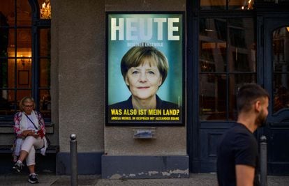 Poster announcing Angela Merkel's first public interview after leaving office last December.