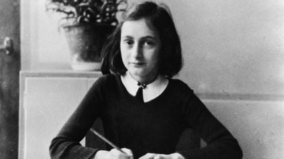 Anne Frank aged 12, doing homework.