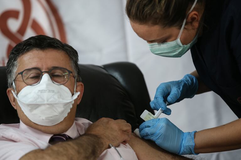 A volunteer received the vaccine from US company Pfizer and Germany's BioNTech in Ankara in October.