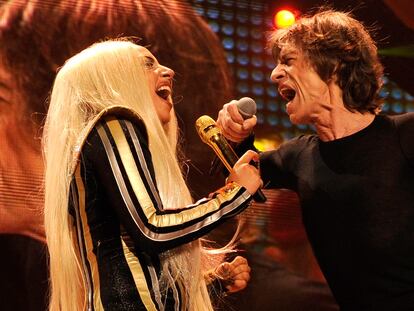 NEWARK, NJ - DECEMBER 15:  Lady Gaga and Mick Jagger of The Rolling Stones performs at the Prudential Center on December 15, 2012 in Newark, New Jersey. (Editorial Use Only) The Rolling Stones concert is being telecast live worldwide via pay-per-view at 9pm EST/6pm PST.  (EDITORIAL USE ONLY)  (Photo by Kevin Mazur/WireImage)
