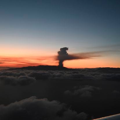In this photo provided by the Spanish government and taken from a plane carrying Spain's Prime Minister Pedro Sanchez, a volcano erupts on the island of La Palma in the Canaries, Spain, Sunday Sept. 19, 2021. Lava continues to flow slowly from a volcano that erupted in Spain’s Canary Islands off northwest Africa. The head of the islands' regional government said Monday he expects no injuries to people in the area after some 5,000 were evacuated.(Borja Puig de la Bellacasa/Spanish Government via AP)