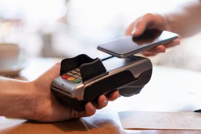 Contactless payment with smartphone, close-up