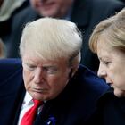 (FILES) In this file photo taken on November 11, 2018 then US President Donald Trump (L) and German Chancellor Angela Merkel (R) speak as they attend a ceremony at the Arc de Triomphe in Paris as part of commemorations marking the 100th anniversary of the 11 November 1918 armistice, ending World War I. - Germany heads into an election on September 26, 2021, the most suspenseful vote in a generation in Europe's biggest economy that will see Chancellor Angela Merkel step down after 16 years in power. (Photo by Francois Mori / POOL / AFP)