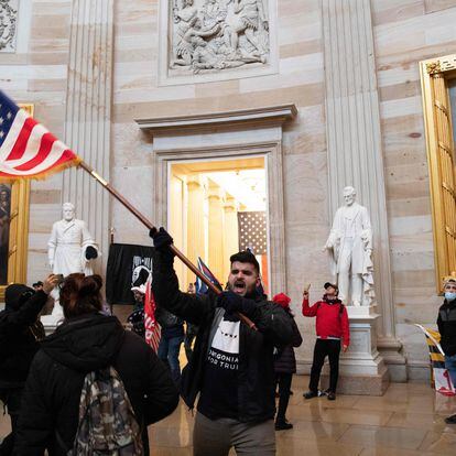 Supporters of US President Donald Trump protest inside the US Capitol on January 6, 2021, in Washington, DC. - Demonstrators breeched security and entered the Capitol as Congress debated the a 2020 presidential election Electoral Vote Certification. (Photo by SAUL LOEB / AFP)