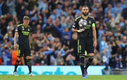 Real Madrid striker Karim Benzema carries the ball into midfield after Manchester City's second goal. 