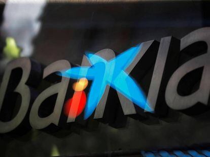 MADRID, 04/09/2020.- Fotografía de multiexposición que muestra los logotipos de las entidades bancarias Bankia y CaixaBank
