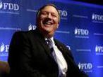 FILE PHOTO: CIA Director Mike Pompeo laughs during the FDD National Security Summit in Washington