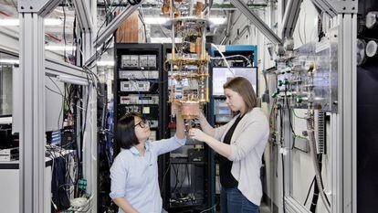 Two IBM researchers prepare a model of a quantum computer at the company's U.S. headquarters in January.