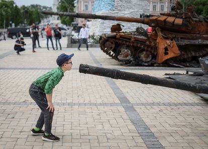 A boy looks at a wrecked Russian infantry vehicle at an exhibition in central kyiv on Saturday.