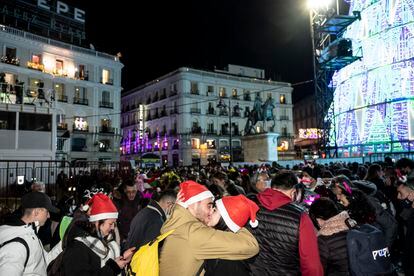 A couple kisses during the New Year's celebration this morning at Puerta del Sol in Madrid.