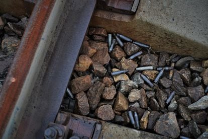 Bullet casings on the train tracks.