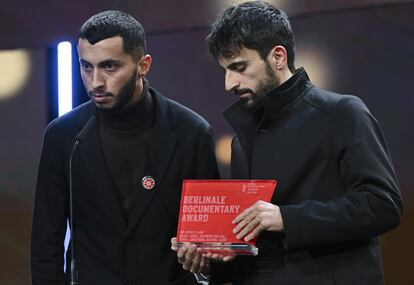 Basel Adra (left) and Yuval Abraham, on February 24 collecting the award for best documentary at the Berlinale.