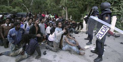 A group of sub-Saharan Africans at the doors of Ceuta’s temporary stay center for immigrants in February.