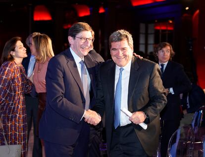 José Ignacio Goirigolzarri , presidente de CaixaBank y José Luis Escrivá, ministro de Seguridad Social