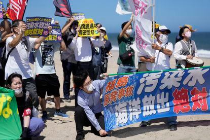 A group of protesters protests on a beach near the Fukushima nuclear power plant in the northeastern Japanese city of Namie on Thursday.