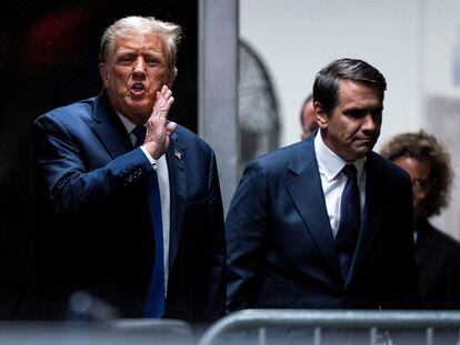 Former U.S President Donald Trump speaks with attorney Todd Blanche as they return from a lunch break at Manhattan criminal court as jury selection continues in New York, April 18, 2024.