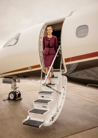 A member of the crew of a Flexjet company jet, at Farnborough airport, southwest of the capital.