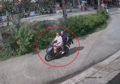Sancho and Arrieta ride a motorcycle through the streets of Koh Phangan in an image from a security camera provided by the Thai police.