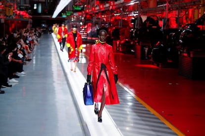 Models present outfits from luxury carmaker Ferrari's first internally-designed fashion collection for women and men as the first step of its rebooted brand extension strategy, in Maranello, Italy, June 13, 2021. Picture taken June 13, 2021. REUTERS/Remo Casilli