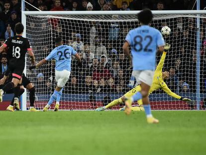 Manchester City's Riyad Mahrez, second left scores his side's third goal during the group G Champions League soccer match between Manchester City and Sevilla at the Etihad stadium in Manchester, England, Wednesday, Nov. 2, 2022. (AP Photo/Rui Vieira)