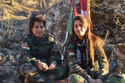 Two fighters from the Kurdistan Freedom Party (PAK) rest after carrying out several military exercises on Monday, January 2, at an undetermined point on the Iran-Iraq border.