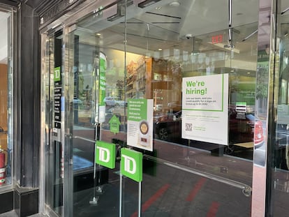 A sign for a Washington bank branch offers a bonus of up to $1,500 to start working at the institution.