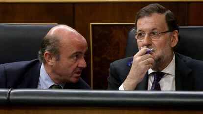 Luis de Guindos y Mariano Rajoy