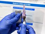 FILE - In this July 27, 2020, file photo, a nurse prepares a shot as a study of a possible COVID-19 vaccine, developed by the National Institutes of Health and Moderna Inc., gets underway in Binghamton, N.Y. The U.S. is poised to give the green light as early as Friday, Dec. 18, to a second COVID-19 vaccine, a critical new weapon against the surging coronavirus. Doses of the vaccine developed by Moderna Inc. and the National Institutes of Health will give a much-needed boost to supplies as the biggest vaccination effort in the nation’s history continues. (AP Photo/Hans Pennink, File)