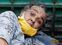 A woman lies in the back of a load carrier waiting to enter a COVID-19 hospital for treatment, amidst the spread of the coronavirus disease (COVID-19), in Ahmedabad, India, April 26, 2021. REUTERS/Amit Dave