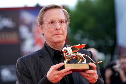 William Friedkin poses with the Golden Lion at the Venice Film Festival in August 2013. 