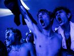People react during a concert by a Danish band "The Minds of 99" amid the coronavirus disease (COVID-19) outbreak, in Copenhagen's Parken stadium, Denmark, September 11, 2021. Picture taken September 11, 2021. Ritzau Scanpix/Olafur Steinar Gestsson via REUTERS THIS IMAGE HAS BEEN SUPPLIED BY A THIRD PARTY. DENMARK OUT. NO COMMERCIAL OR EDITORIAL SALES IN DENMARK