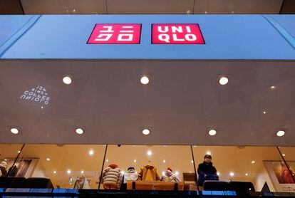 FILE PHOTO: A shopper looks on, inside a Fast Retailing's Uniqlo casual clothing store in Tokyo, Japan January 11, 2023. REUTERS/Issei Kato/File Photo