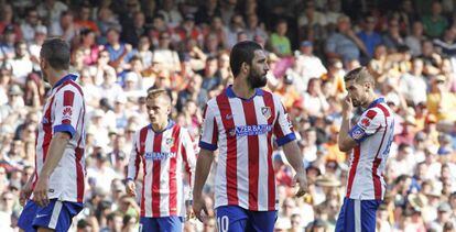 Koke, Griezmann, Arda y Gabi, tras encajar un gol ante el Valencia