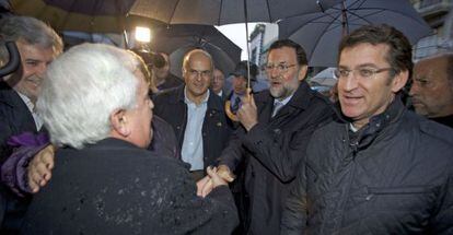 Mariano Rajoy y Alberto N&uacute;&ntilde;ez Feij&oacute;o saludan a Jos&eacute; Luis Baltar en Ourense.