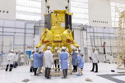 Technicians from the Russian space agency finalize the details of the Luna-25 module.