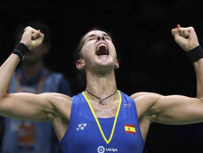 Carolina Marin of Spain reacts after beating Pusarla V. Sindhu of India in their women's badminton championship match at the BWF World Championships in Nanjing, China, Sunday, Aug. 5, 2018. (AP Photo/Mark Schiefelbein)