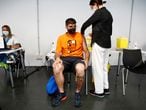 A man receives a vaccine against the coronavirus disease (COVID-19) as the country extends vaccination to curb surge among population under 30, in Madrid, Spain, July 12, 2021. REUTERS/Javier Barbancho